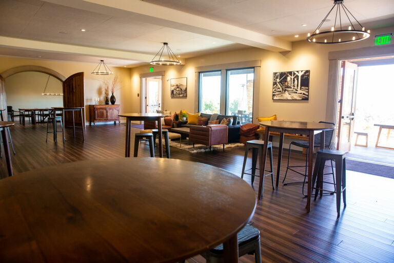 Tables and stools and lounge area in the Nagasawa tasting room